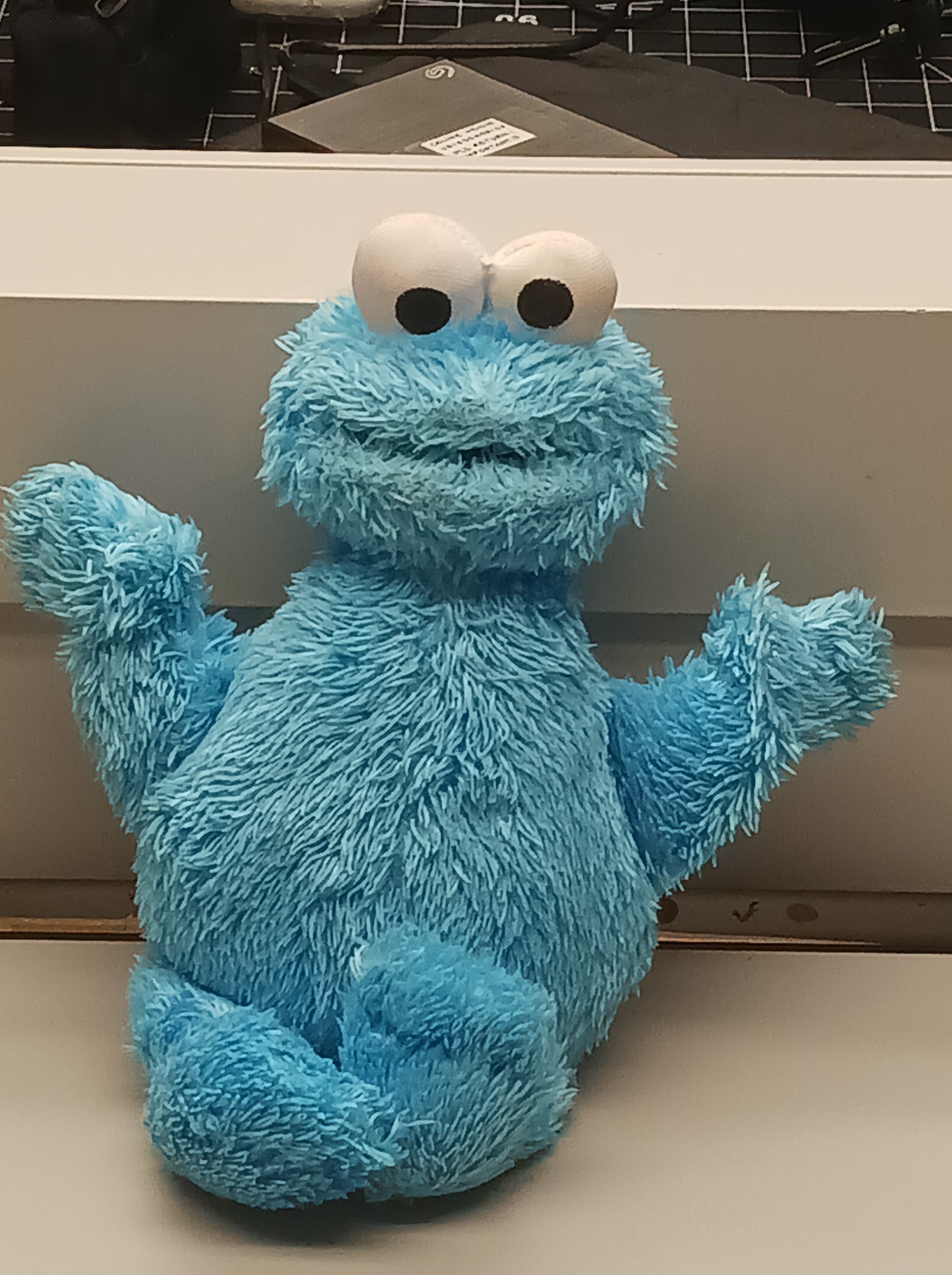 Object 3 - cookie monster <p>
Material state: refined <p>
Material plasticity: pliable <p>
Material use: entertainment <p>
Feels fluffy, soft <p>
Blue, white, black